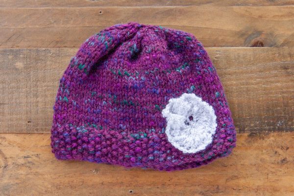 Purple Fleck Hat with White Flower Accent